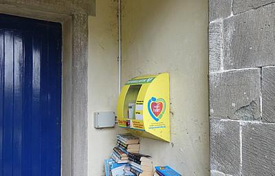 Defibrillator in the porch of St Anne's Village Hall, Whitstone